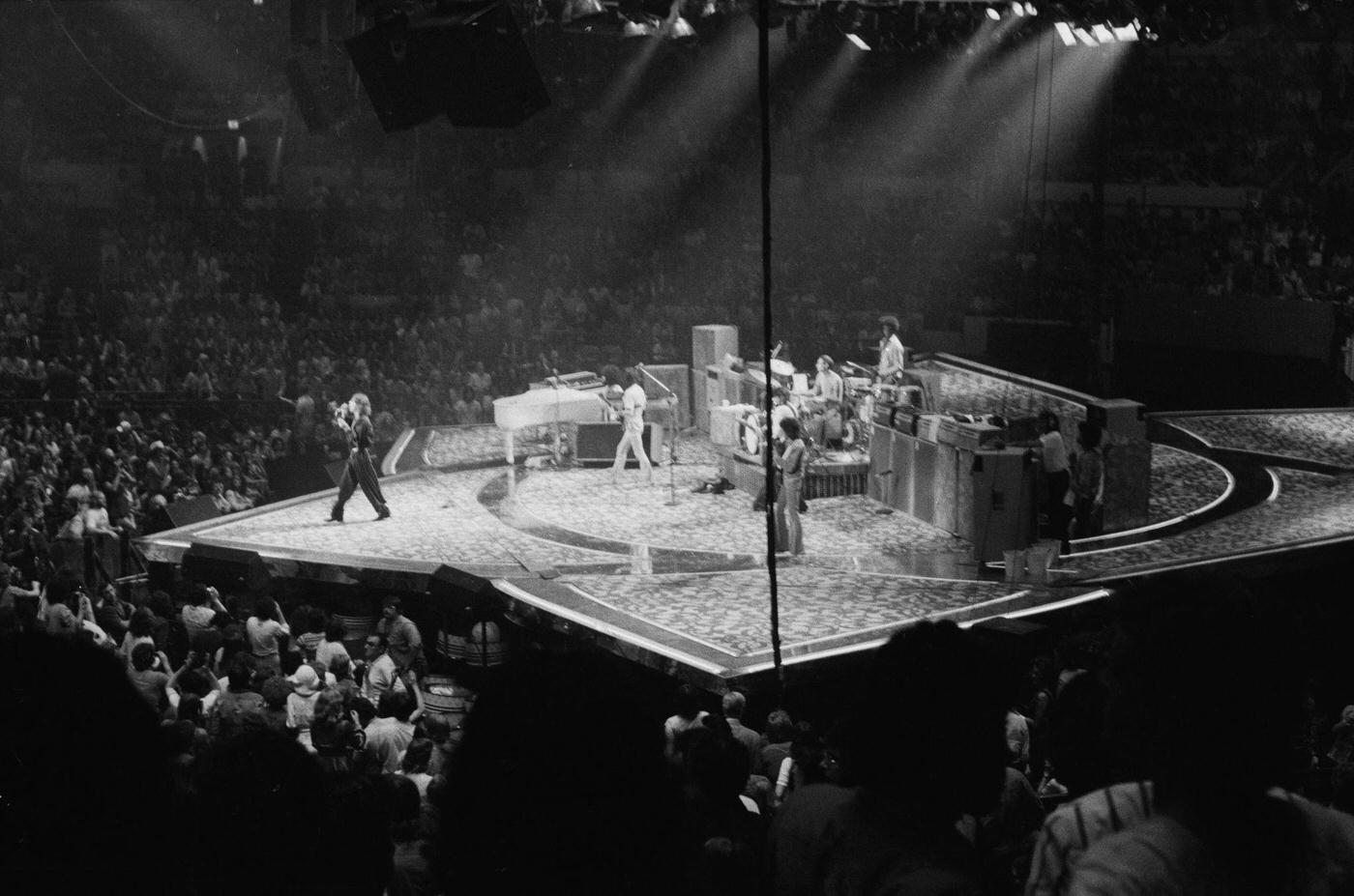 Mick Jagger, with Bill Wyman and Charlie Watts, performs with The Rolling Stones , 1975.