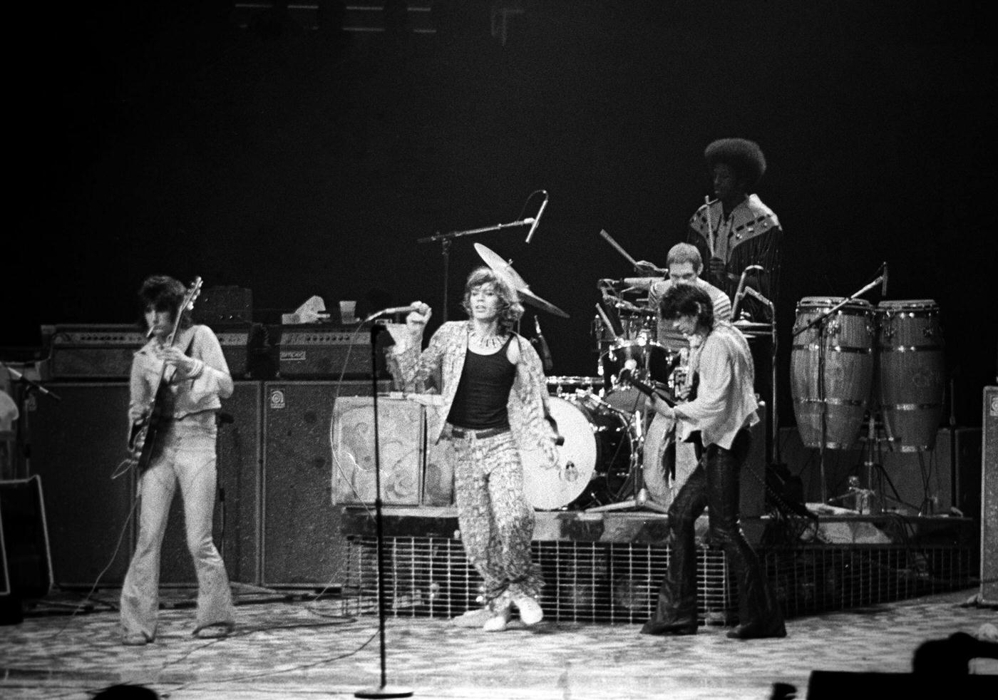 Ronnie Wood, Mick Jagger, Keith Richards, and Charlie Watts perform with percussionist Ollie Brown at Madison Square Garden during the band’s ‘Tour of America ’75” on June 25, 1975, in New York, New York.
