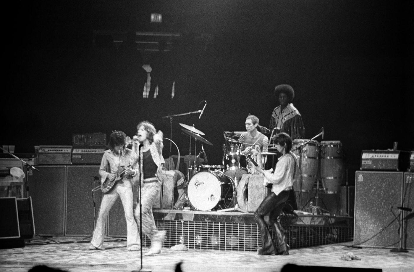Ronnie Wood, Mick Jagger, Charlie Watts, and Keith Richards perform with percussionist Ollie Brown at Madison Square Garden during the band’s “Tour of America ’75” on June 25, 1975, in New York, New York.