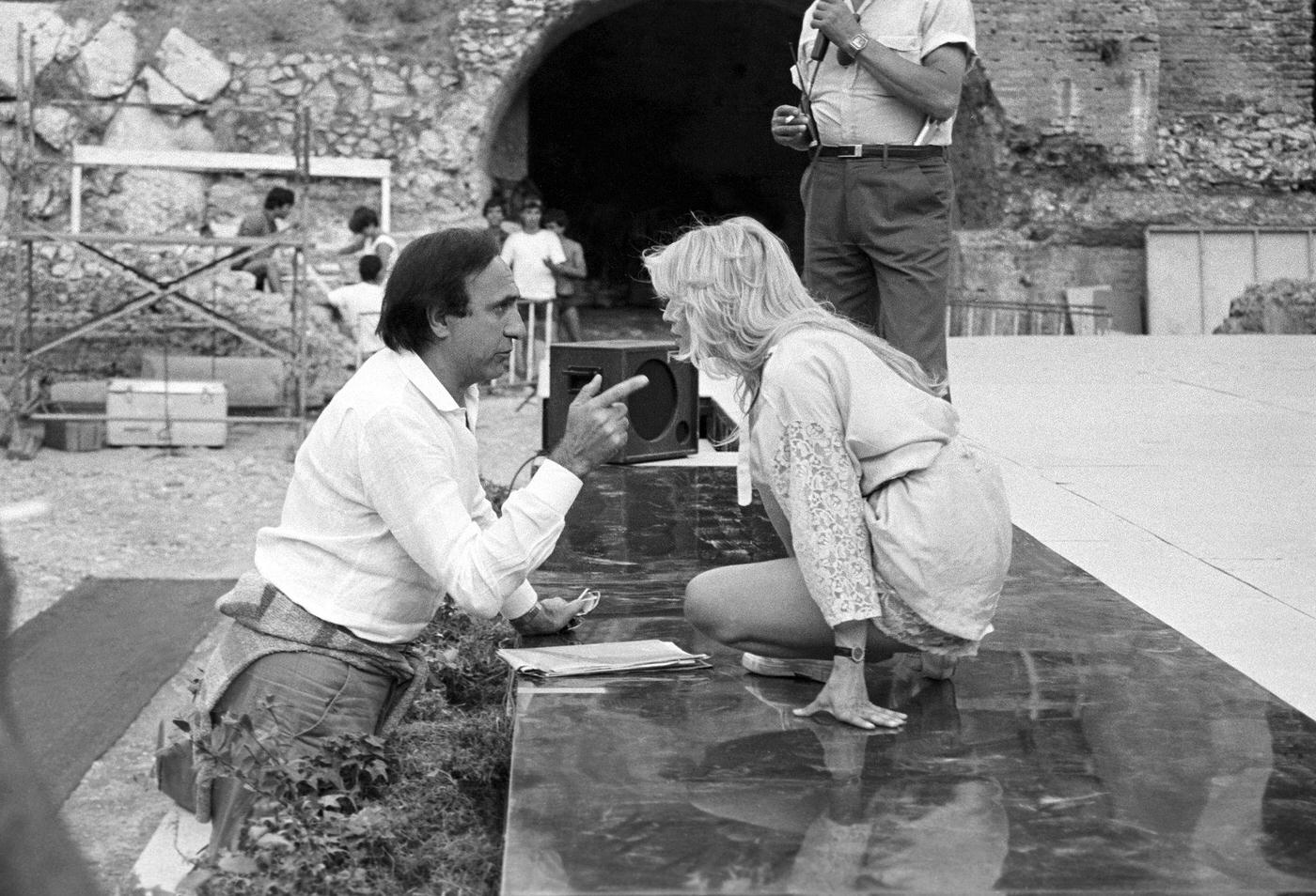 #41 Pippo Baudo and Heather Parisi rehearsing for the Nastri d’Argento ceremony at the Ancient Theatre of Taormina, 1984.