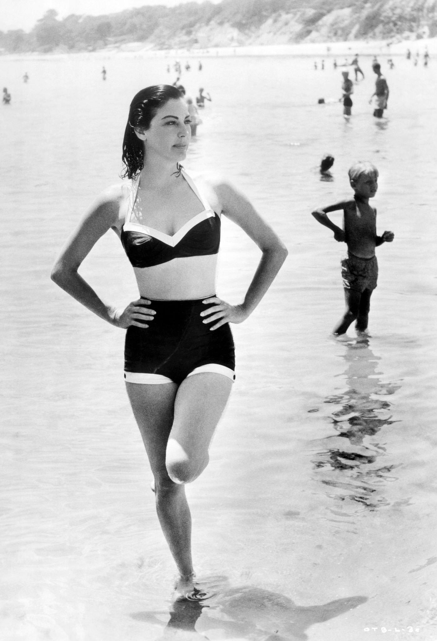 #9 Ava Gardner on the beach in a two-piece bathing suit