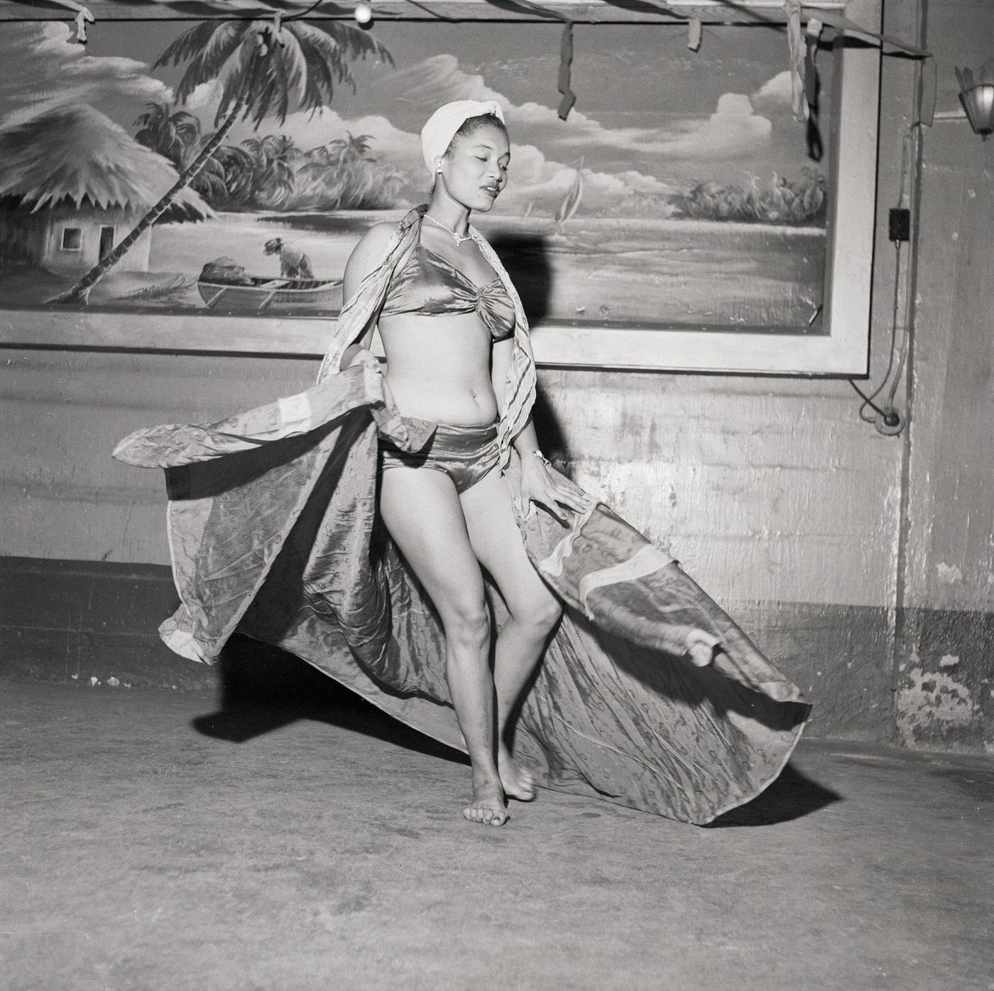 #12 Woman performing in bikini and scarves, Trinidad