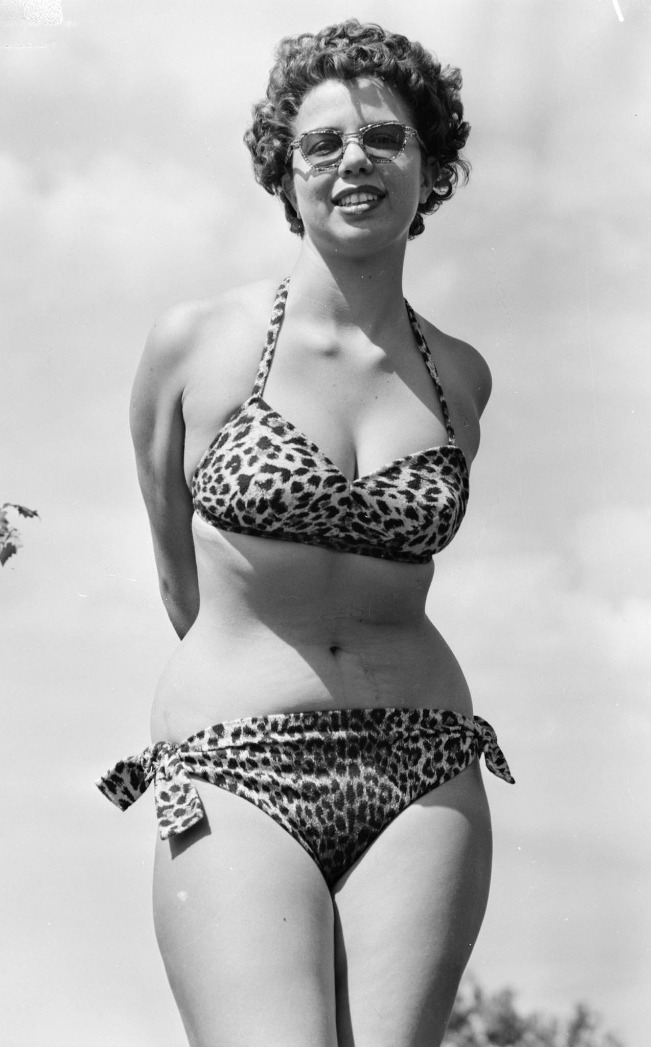 #27 Woman in a leopardskin bikini and sunglasses, 1945.