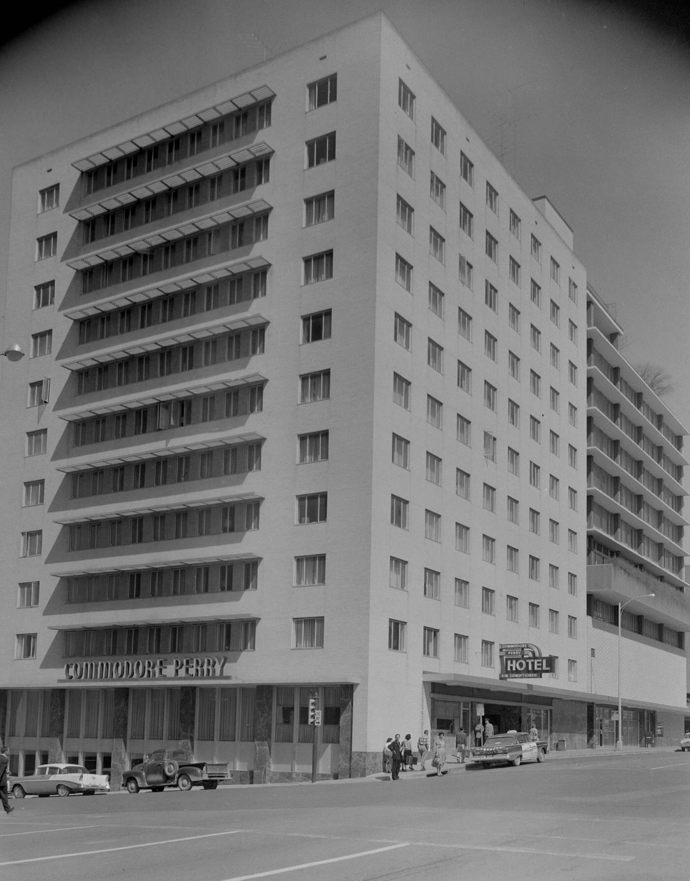 #46 Commodore Perry Hotel Exterior with Parked Cars and People, 1959