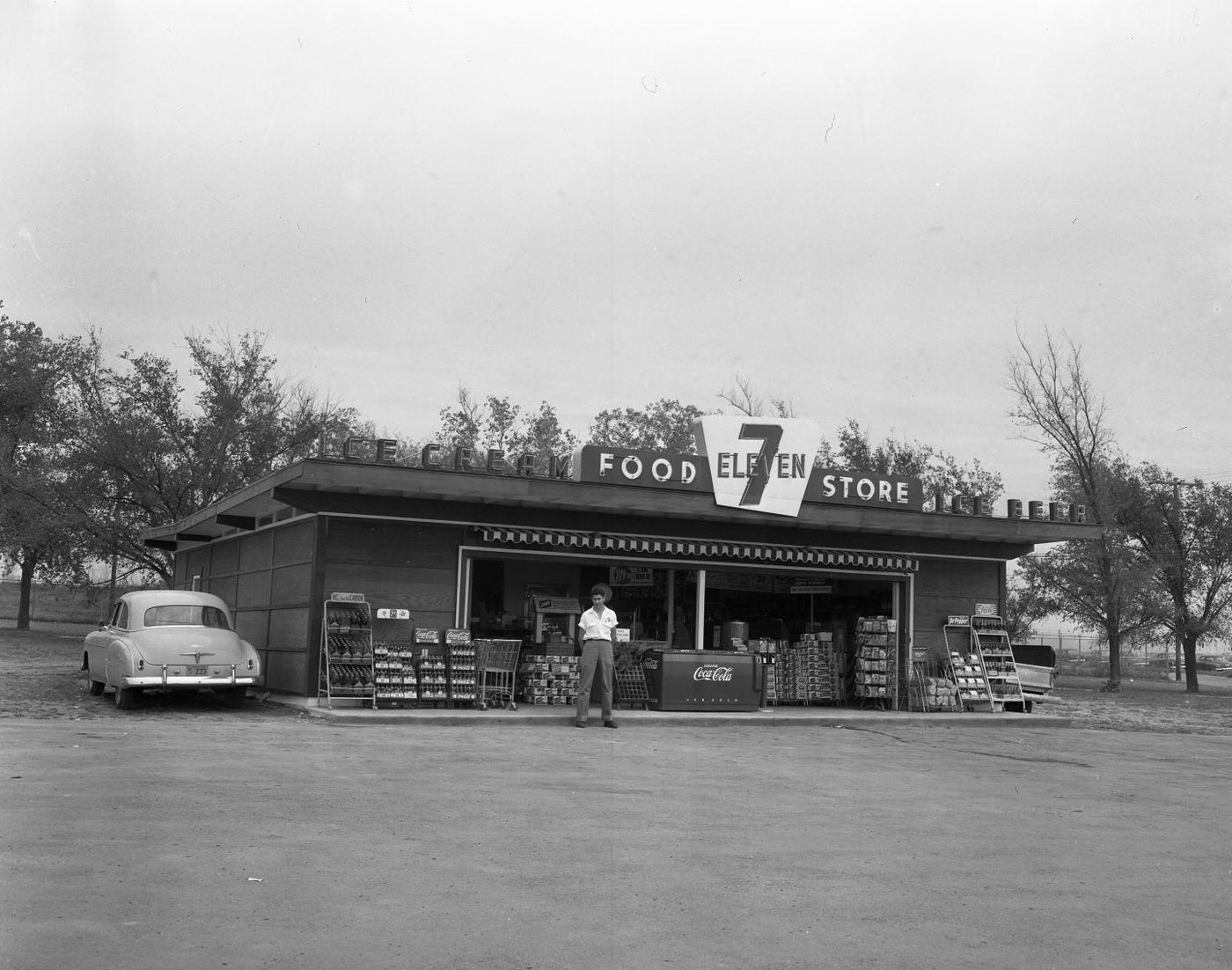 #47 Man Standing Outside 7-Eleven Store, 1953
