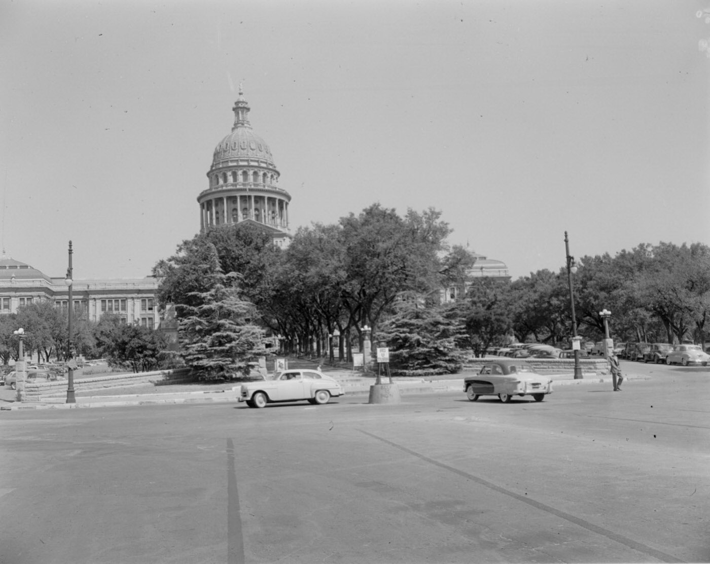 #25 Front View of the Capitol Building in Austin with Trees and Cars, 1954.
