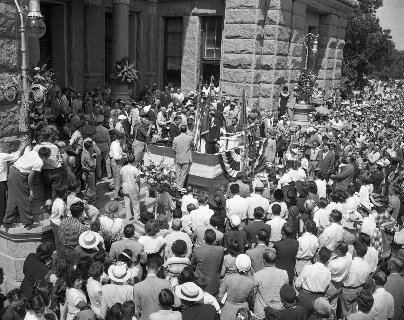 #26 Gen. Douglas MacArthur at Podium, Crowd Watching, 1951.