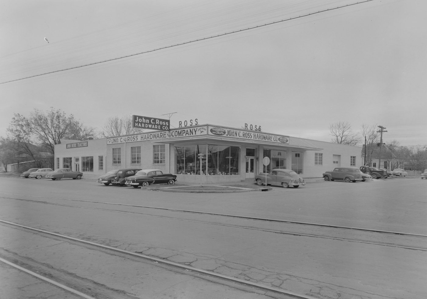 #44 John C. Ross Hardware and John Deere Stores with Cars, 1954.