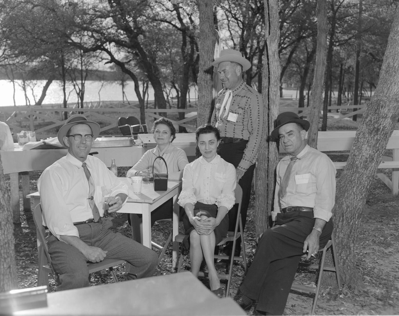 #45 Lago Vista Open House BBQ with Guests Seated Outdoors, 1958.