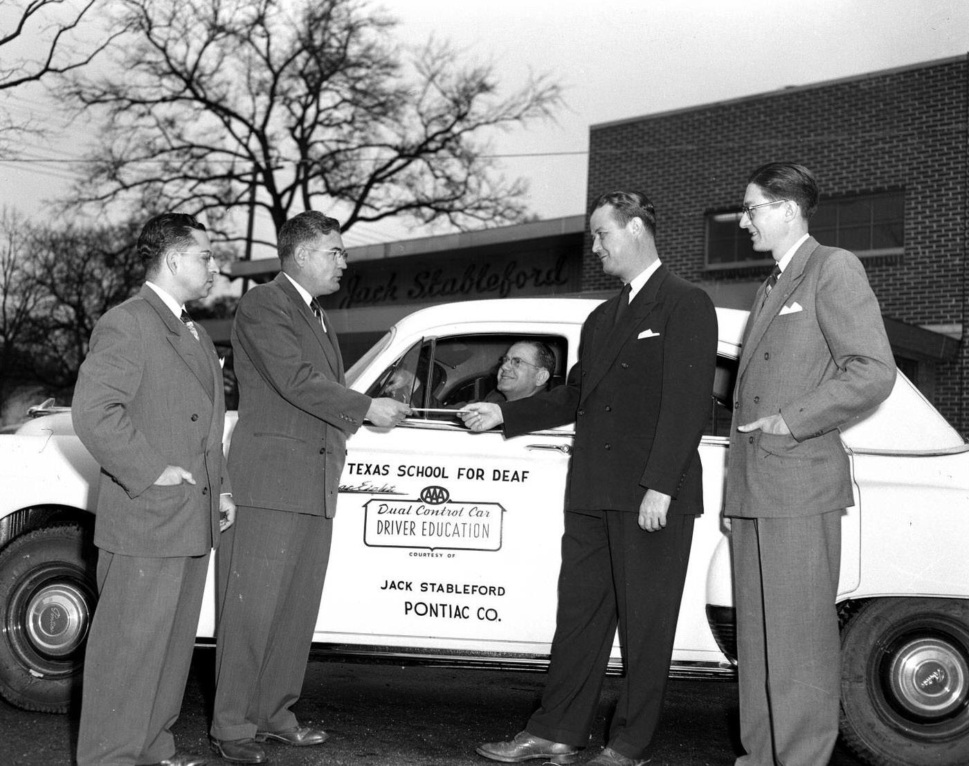 #69 Men Beside Texas School for Deaf Driver Education Car, 1952.