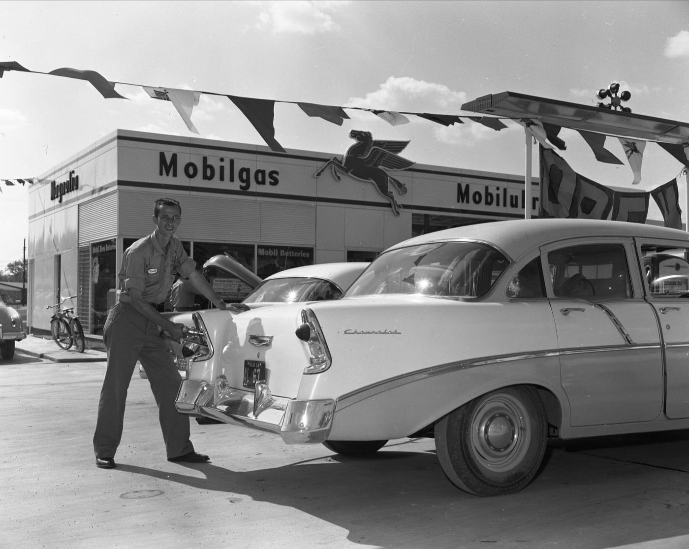 #74 Gas Pumping at Mobil Station at Airport & Gunter, 1956.
