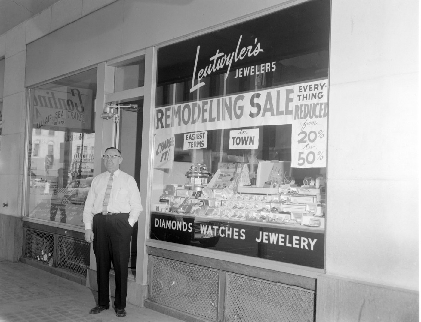 #76 Mr. Leutwyler in Front of His Jewelry Store, 1957.