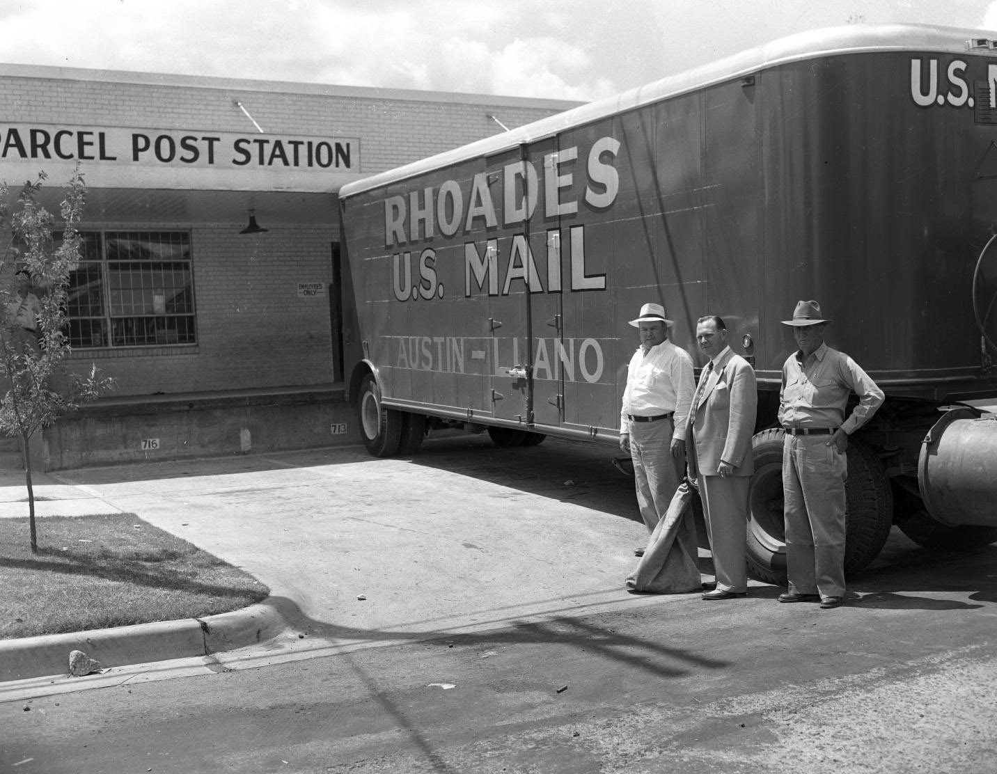 #92 Men Posing in Front of Rhoades Transfer & Storage Truck, 1951.