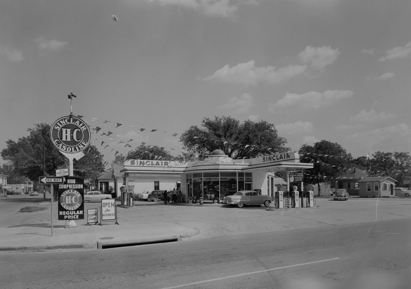 #167 Sinclair Stations, Exterior at 801 E. 1st St. With 3 Men and Parked Cars, 1955.