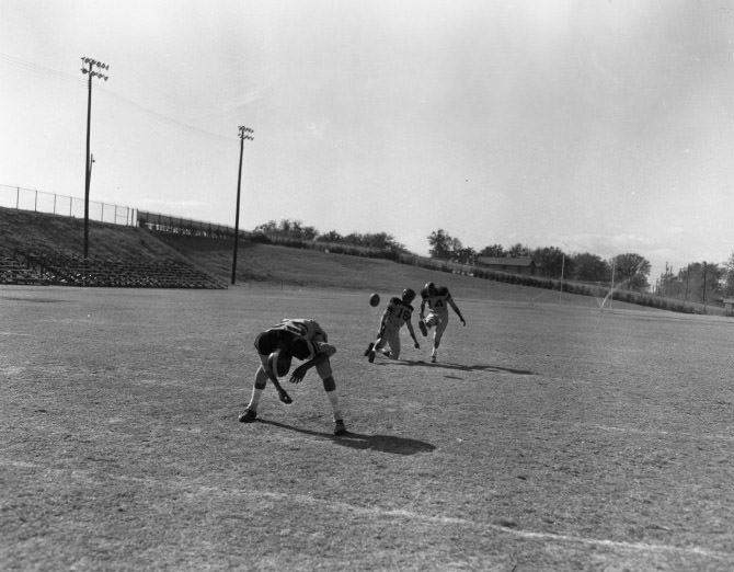 #114 Anderson High School Students Playing Football, 1955.