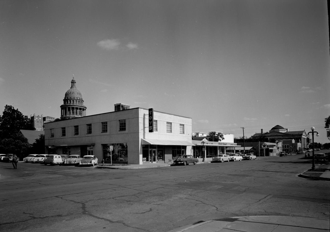 #206 Exterior of Toy Palace Toy Store with Capitol Building in Background, 1956.