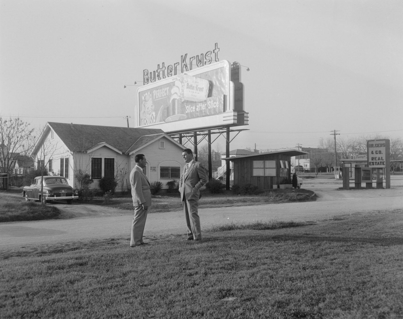 #122 Men Near Butter Krust Billboard, 1954.