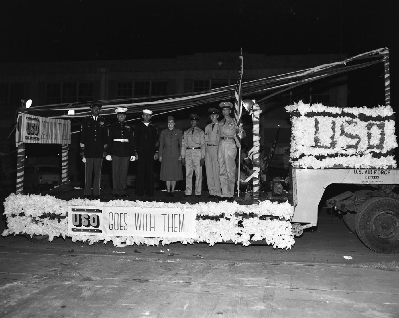 #124 United Fund Parade with Military Personnel on USO Float, 1956.