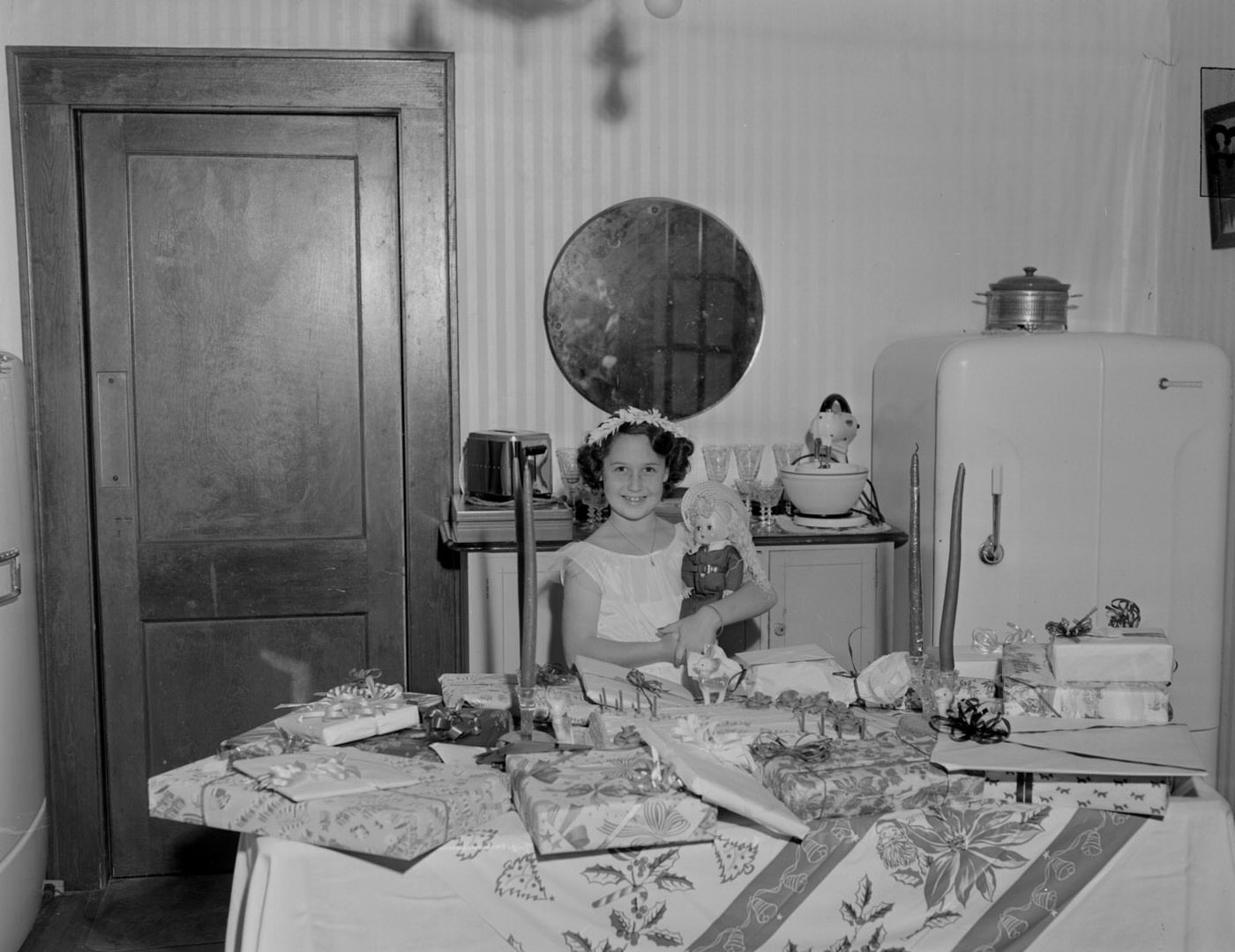 #134 Young Girl with Doll in Front of Birthday Presents, 1951.