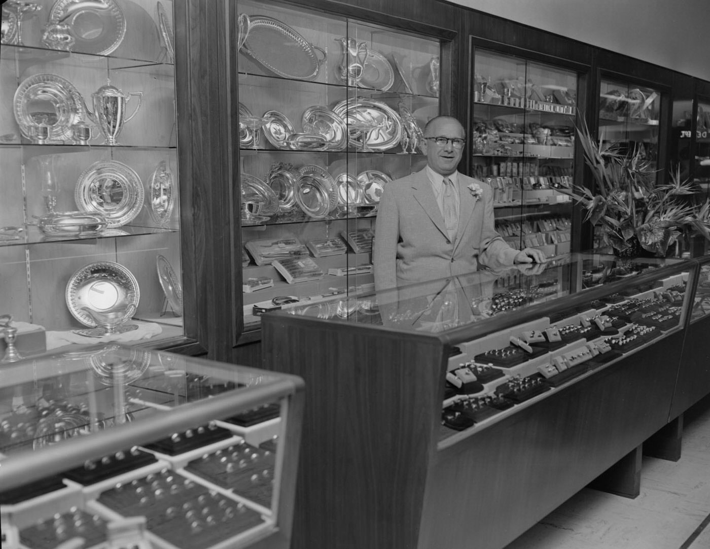 #135 Zales Jewelers with Man Behind Counter, 1953.