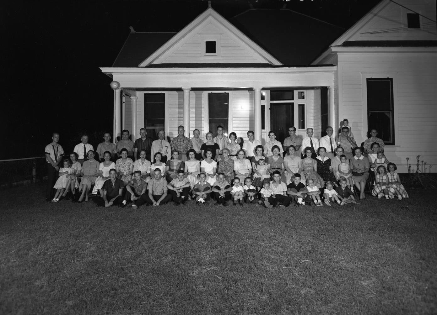 #139 Whalen Family in Front of Victorian Cottage, 1959.