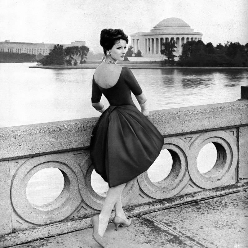 #1 Betsy Pickering in figure-defining silk satin dress, panier framed by Jo Copeland-Patullo, 1954