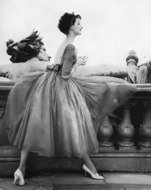 #13 Betsy Pickering in romantic evening dress by Jacques Heim, 1957