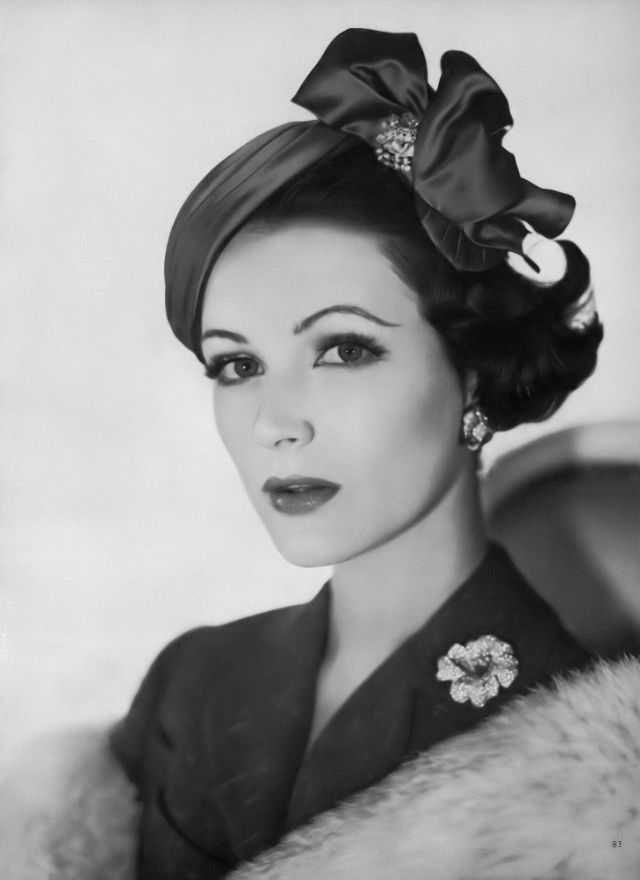 #14 Betsy Pickering in a deep-red velour cap by Tatiana du Plessix, 1957