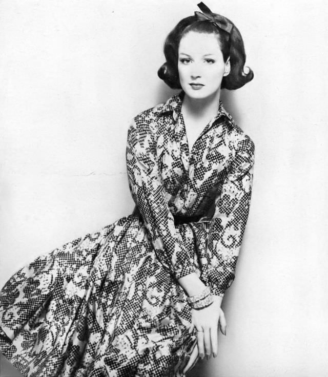 #29 Betsy Pickering in late-day shirt dress of yellow silk surah by Anne Fogarty, 1959