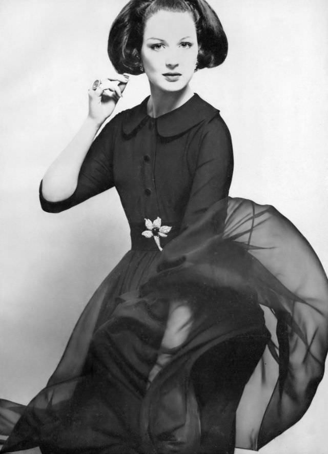 #30 Betsy Pickering in late-day shirtdress of navy blue crêpe by Larry Aldrich, 1959