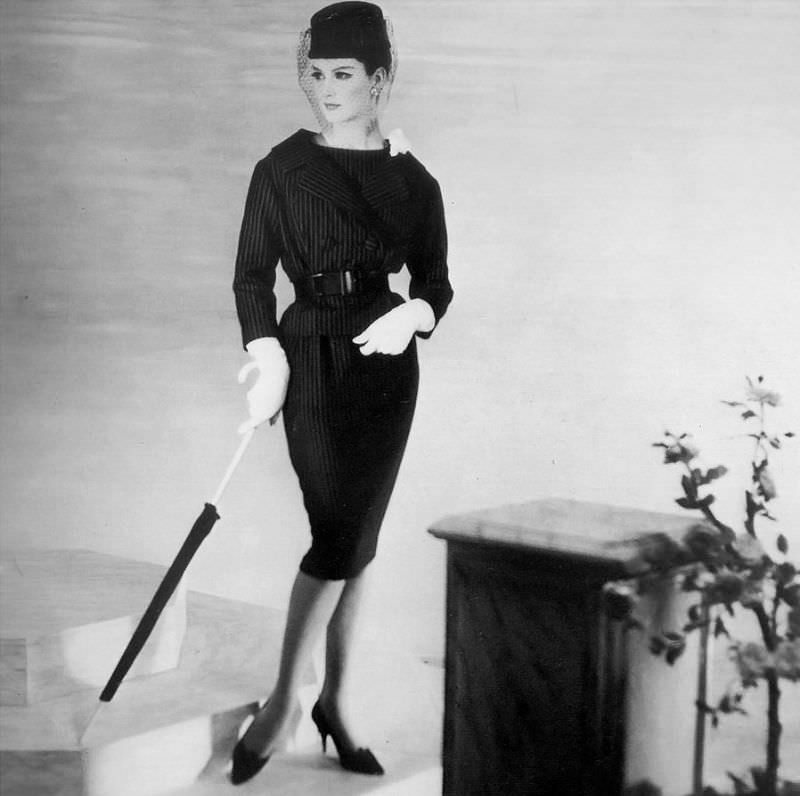 #33 Betsy Pickering in pinstriped suit by Christian Dior, 1959