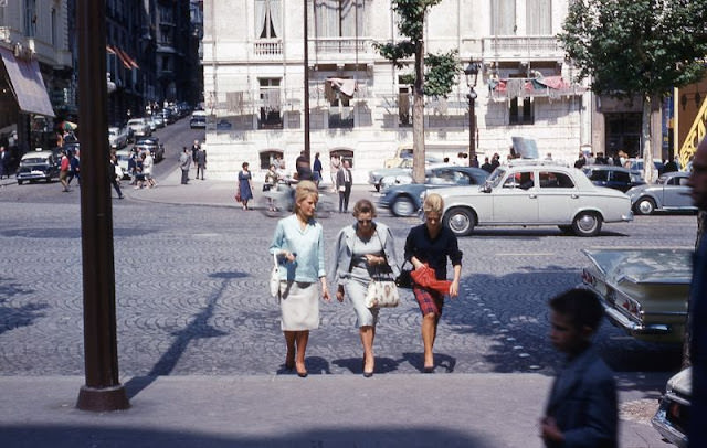 #112 Three ladies crossing the street in Paris, France, circa 1960