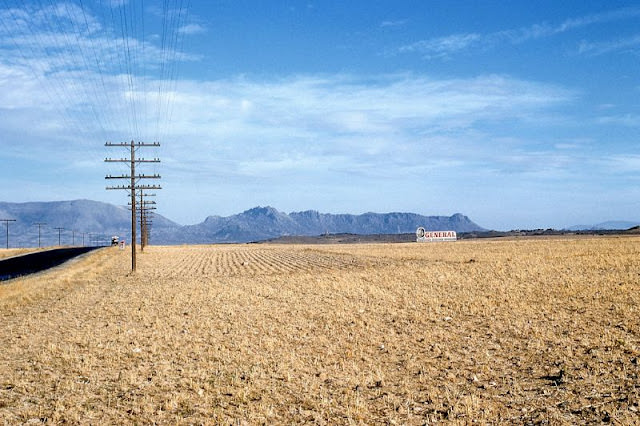 #119 General Tires billboard in open field, probably Spain, 1961