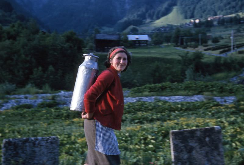 #129 Lady carrying water, somewhere in Switzerland, circa 1964