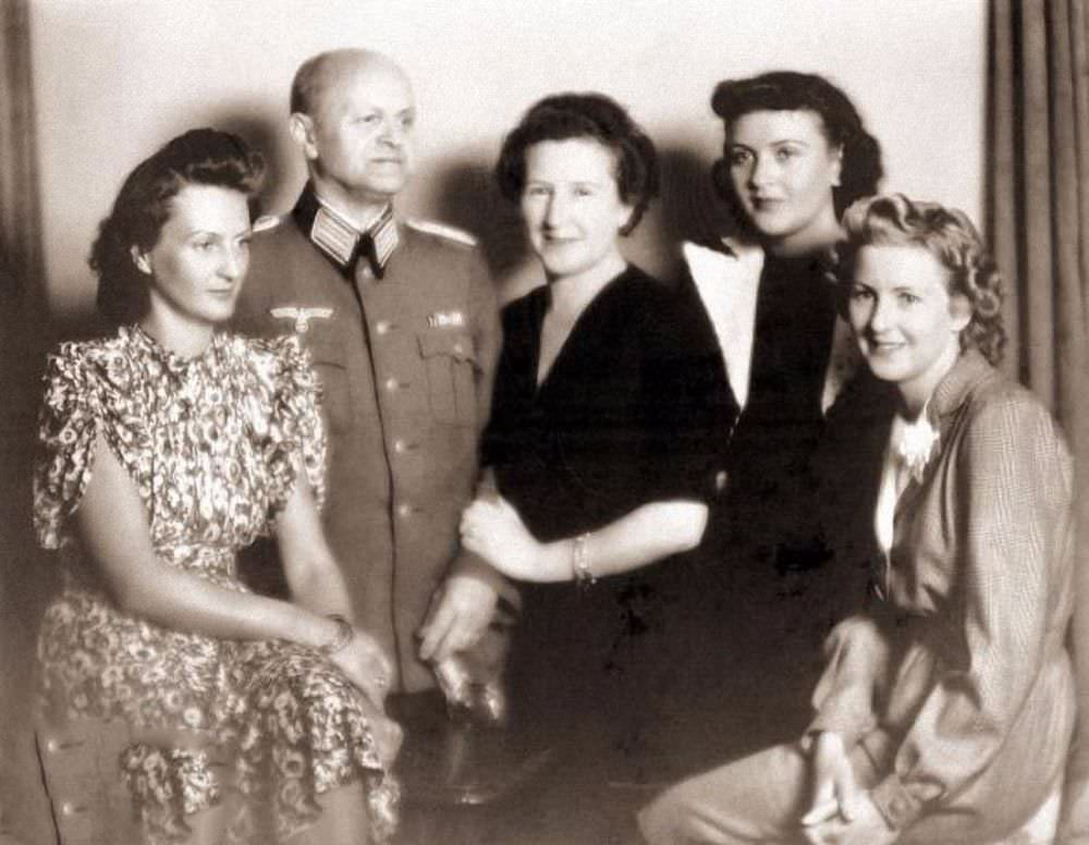 #16 Eva Braun (far right) with her parents, Friedrich “Fritz” and Franziska, and her sisters Ilse (left) and Gretl, 1940.