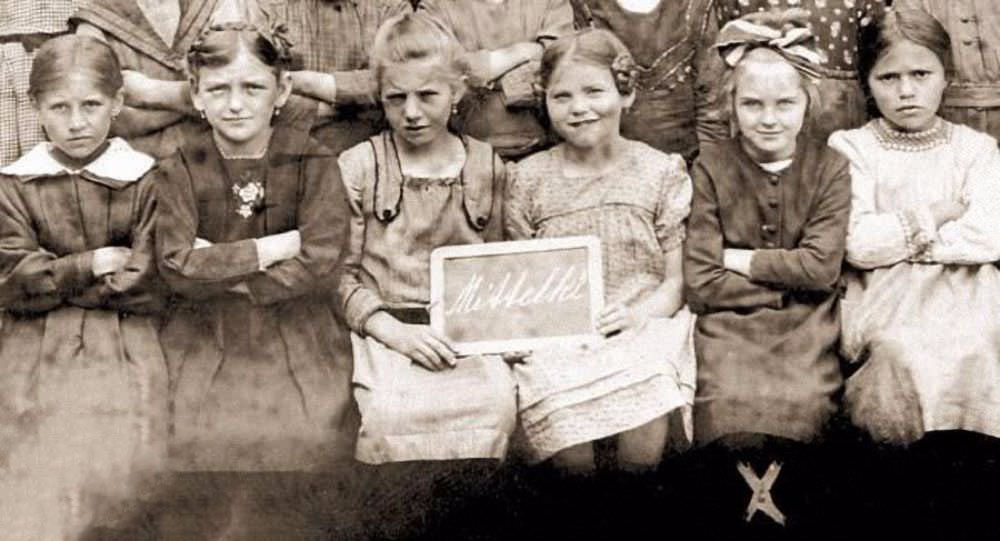 #7 Nine-year-old Eva Braun (second from right), with some of her classmates at the Beilngries convent school Beilngries, Germany, 1922.