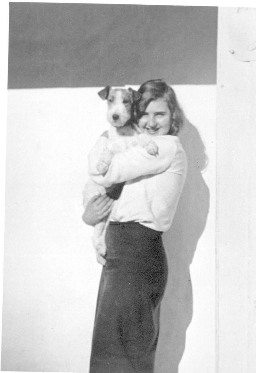 #52 Eva Braun holding a dog, 1932