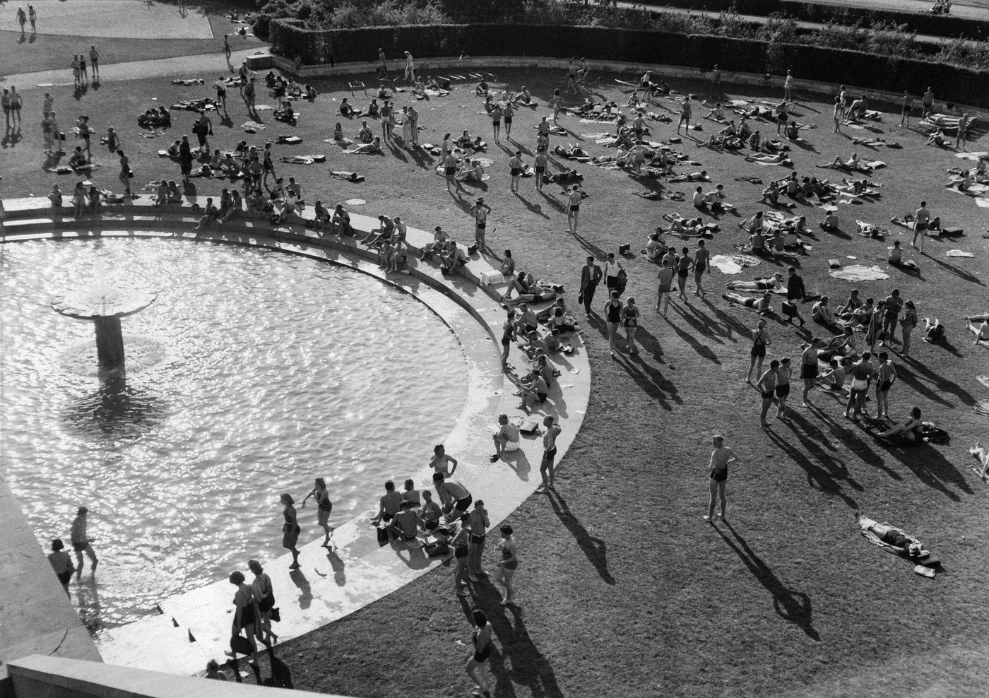 #98 Visitors examining fashion at the Italian stand at the German East Fair Königsberg, 1940.