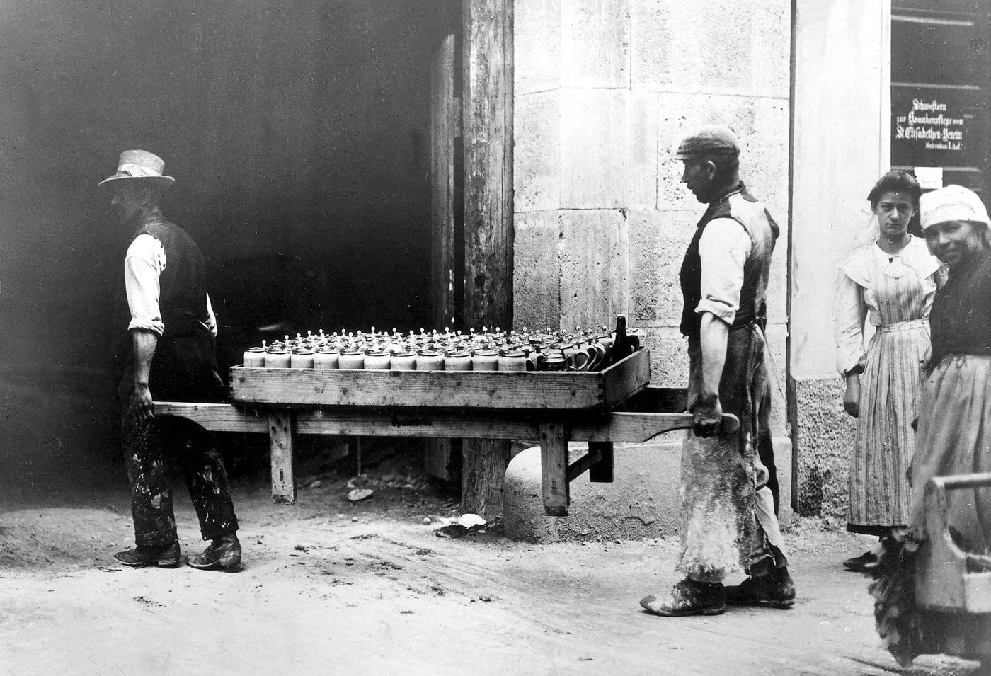 #19 Bricklayers carrying beer, Munich, Germany, around 1900.