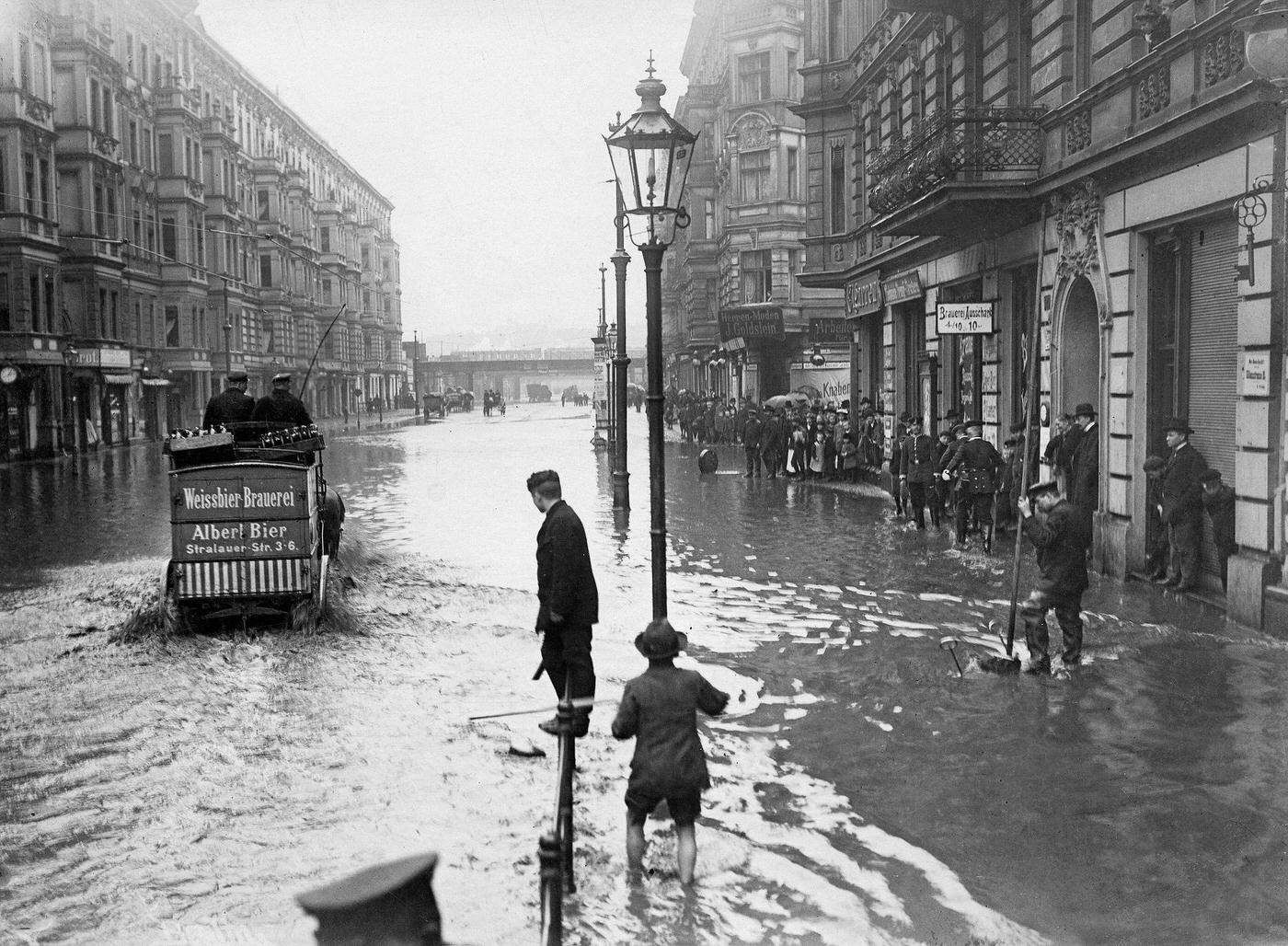 #44 Berlin: People on submerged street after deluge, Germany, 1902.