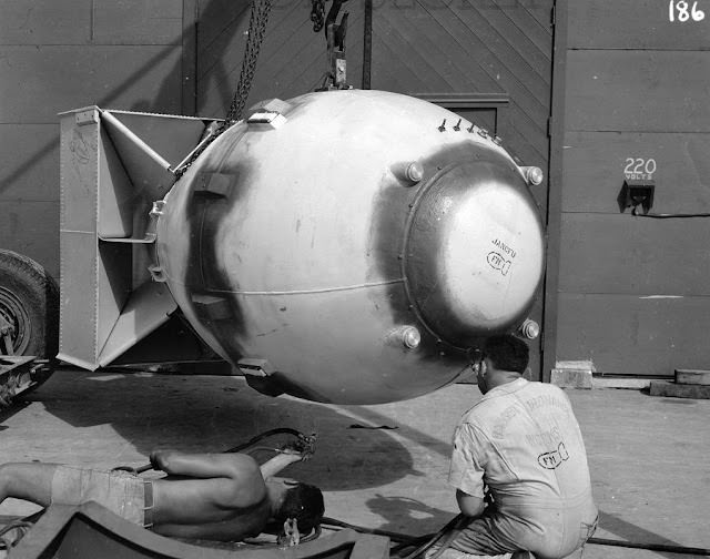 #17 The sealant has been applied. Note the signatures on the tail assembly and the “bomb” on the worker’s shirt.
