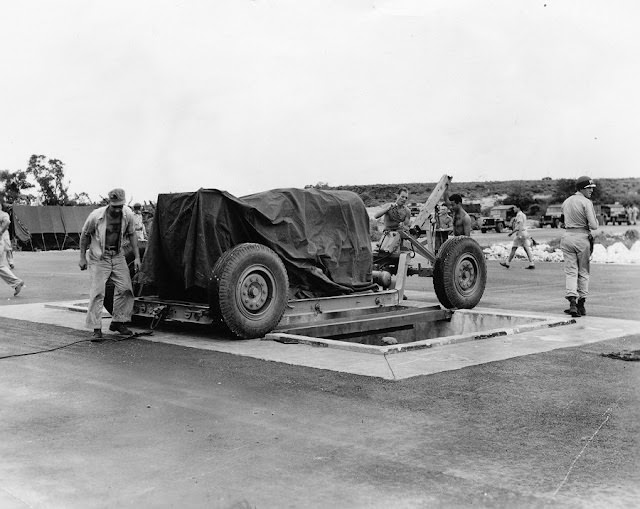 #24 The towing cable is disconnected. Note the MPs keeping guard.