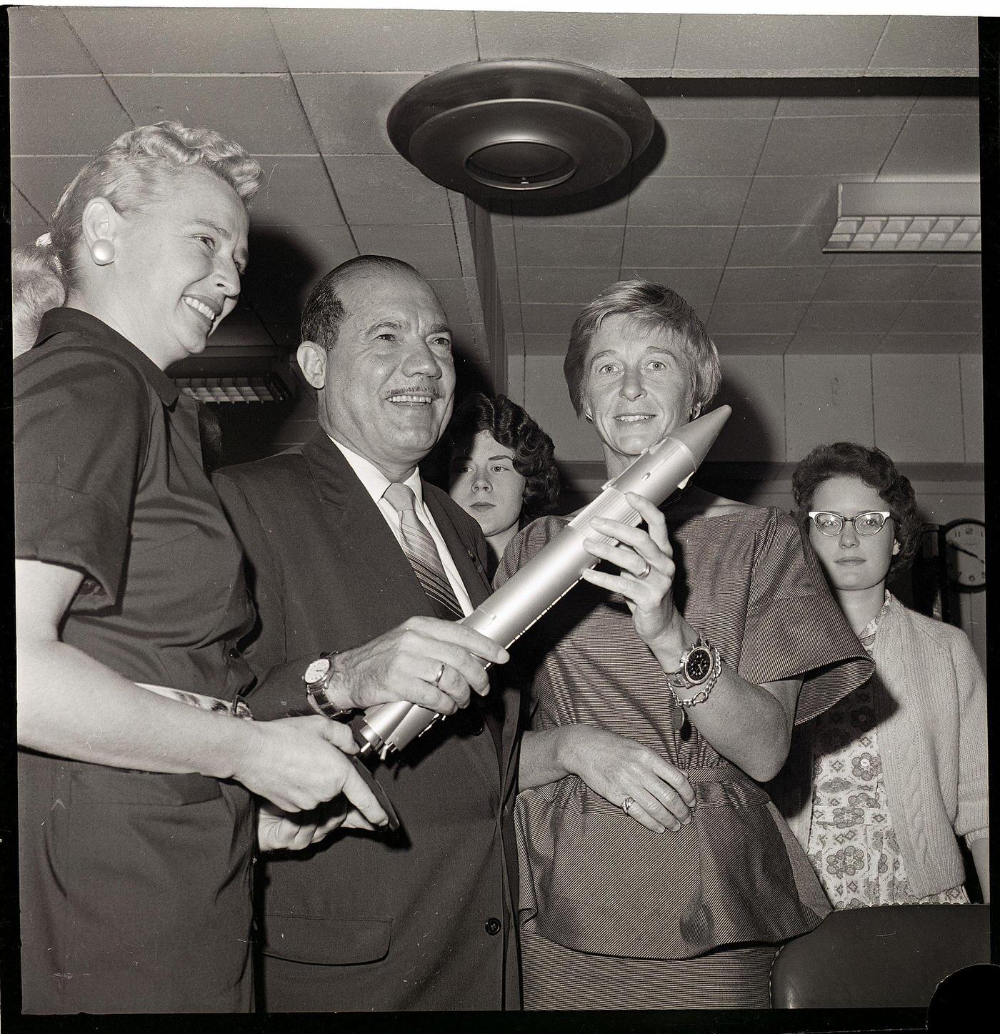 #3 Senator and Two Women Holding Missile Model, 1962