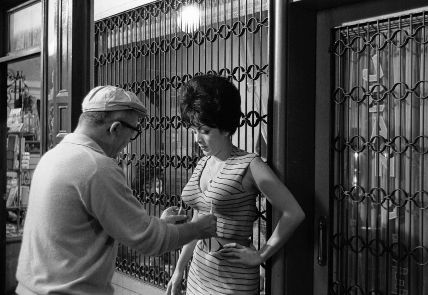 #51 Director Billy Wilder and actress Tura Satana on the set of “Irma la Douce,” Hollywood, California, 1962