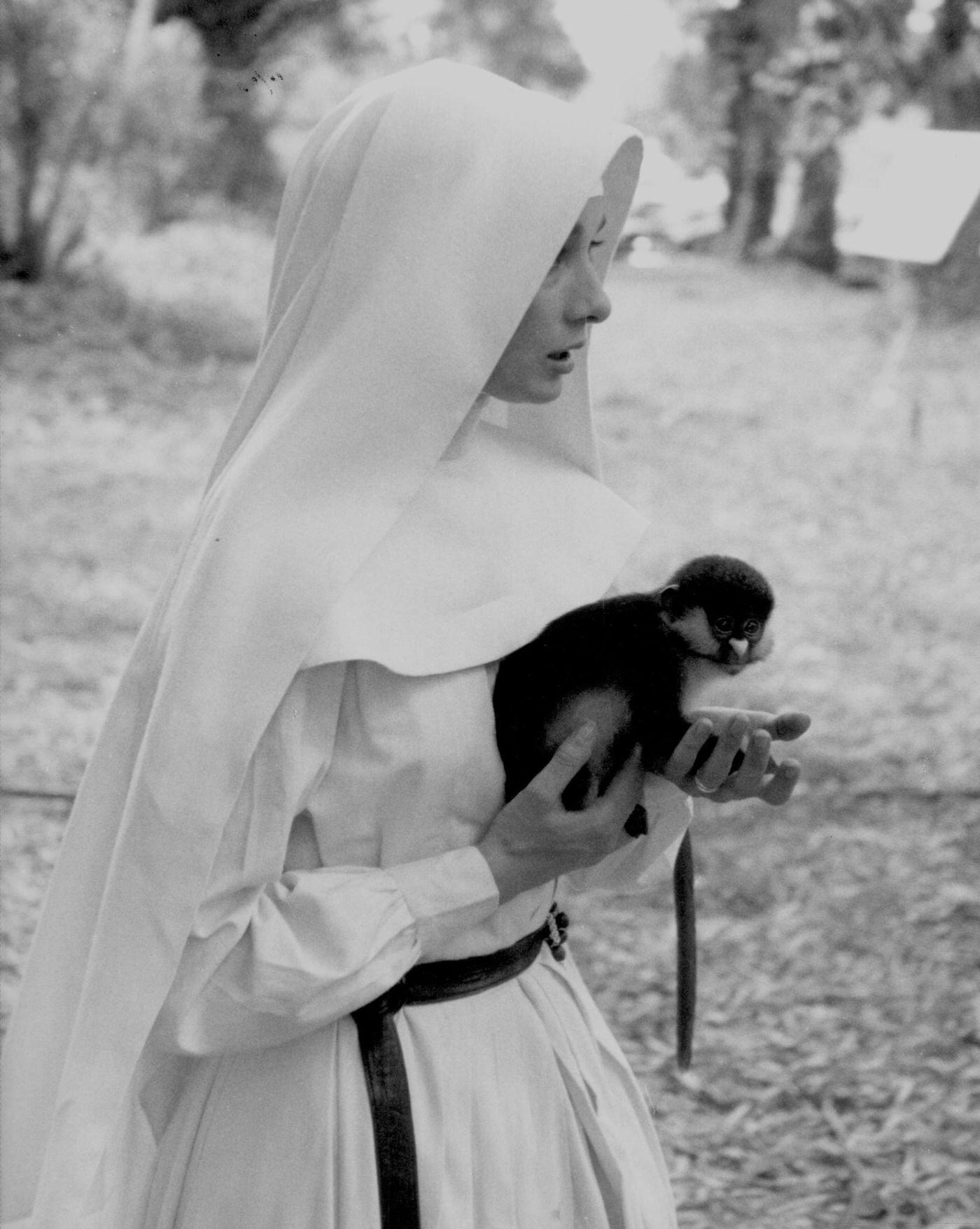 #60 Audrey Hepburn with a monkey on the set of “The Nun’s Story,” Congo, 1958