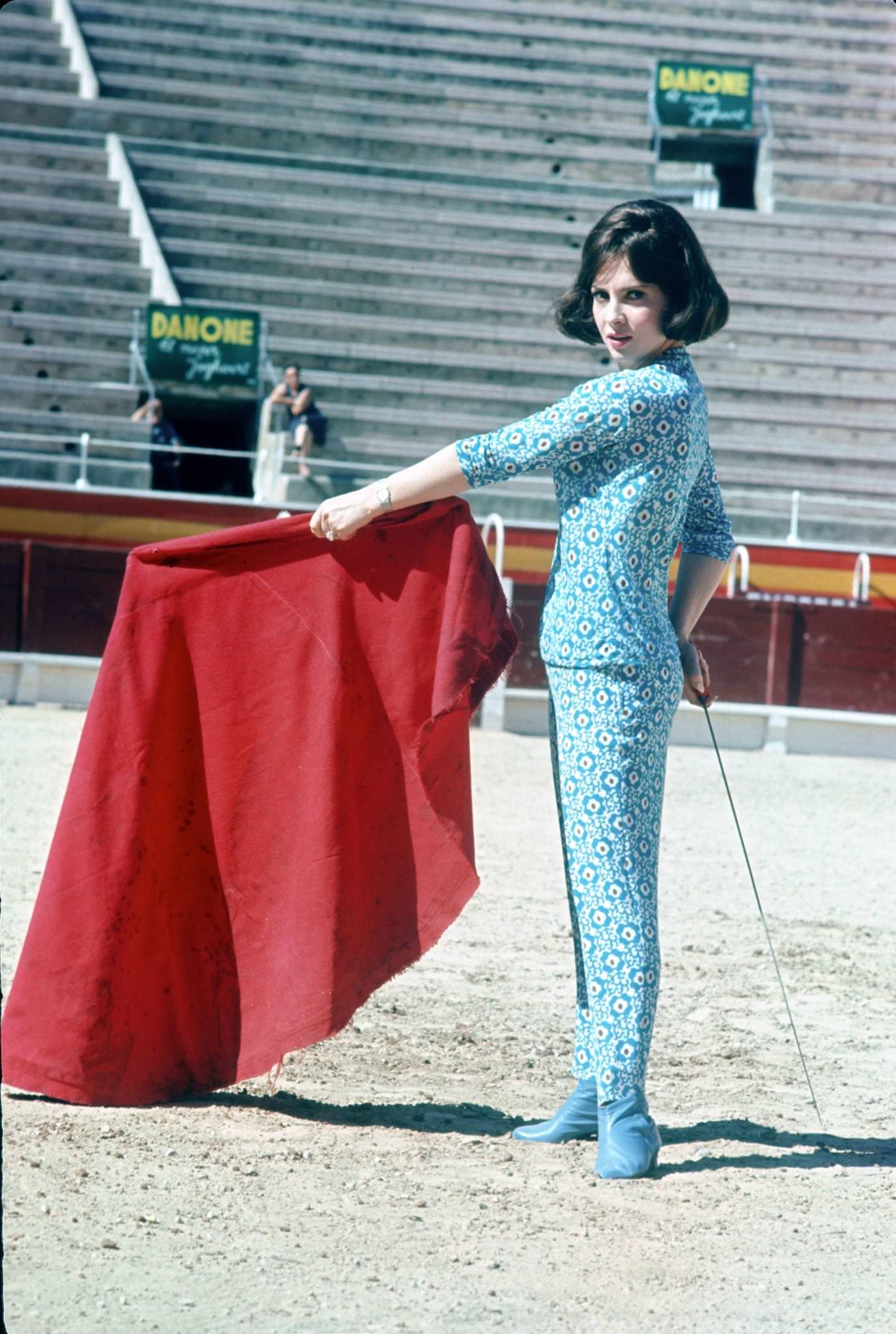 #61 Gina Lollobrigida posing as a torero, Madrid, Spain, 1958