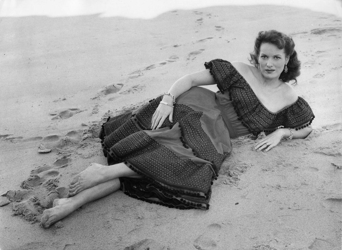 #64 Maureen O’Hara on the beach, Lisbon, Portugal, 1955