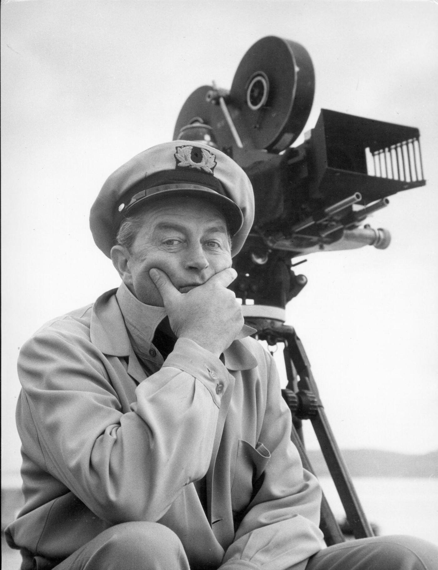 #67 Ray Milland near a camera on the set of “Lisbon,” Lisbon, Portugal, 1955