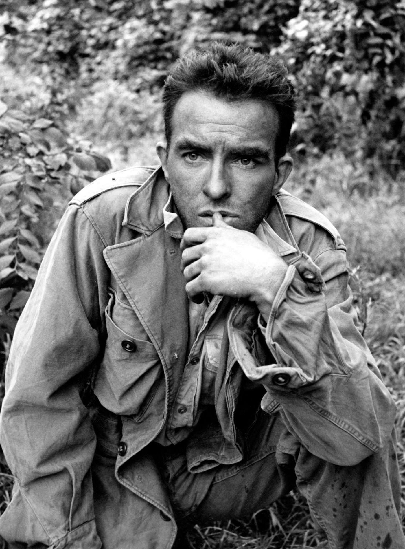 #75 Actor Montgomery Clift poses for a portrait while shooting “The Young Lions” at the Natzweiler-Struthof Concentration Camp in France, 1957.