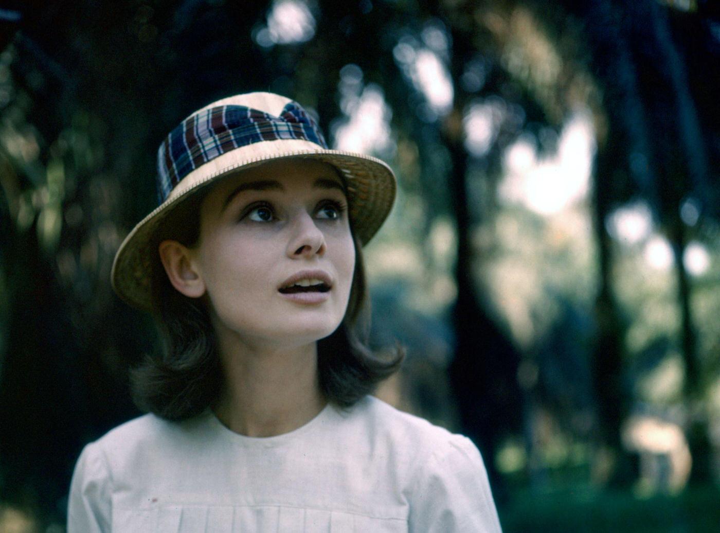 #81 Audrey Hepburn poses with a hat near the rainforest in the Democratic Republic of Congo, 1958.